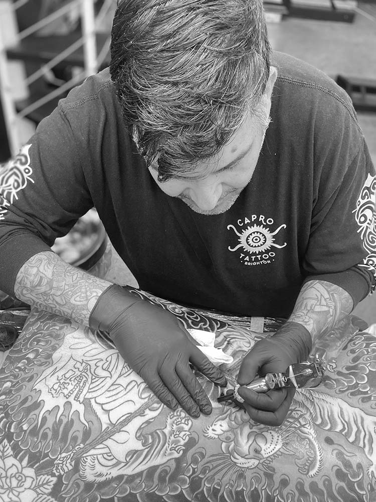 tattoo artist christos serafeim working at 1770 tattoo