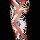Japanese tattoo sleeve by Alex Binnie of black and grey waves with red lightning bolts