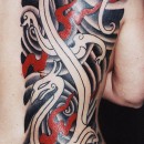 Japanese style half back piece by Alex Binnie with black and grey waves and Celtic dragons with red smoke flames