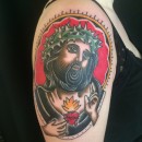 portrait of jesus with sacred heart and crown of thorns in traditional style tattoo
